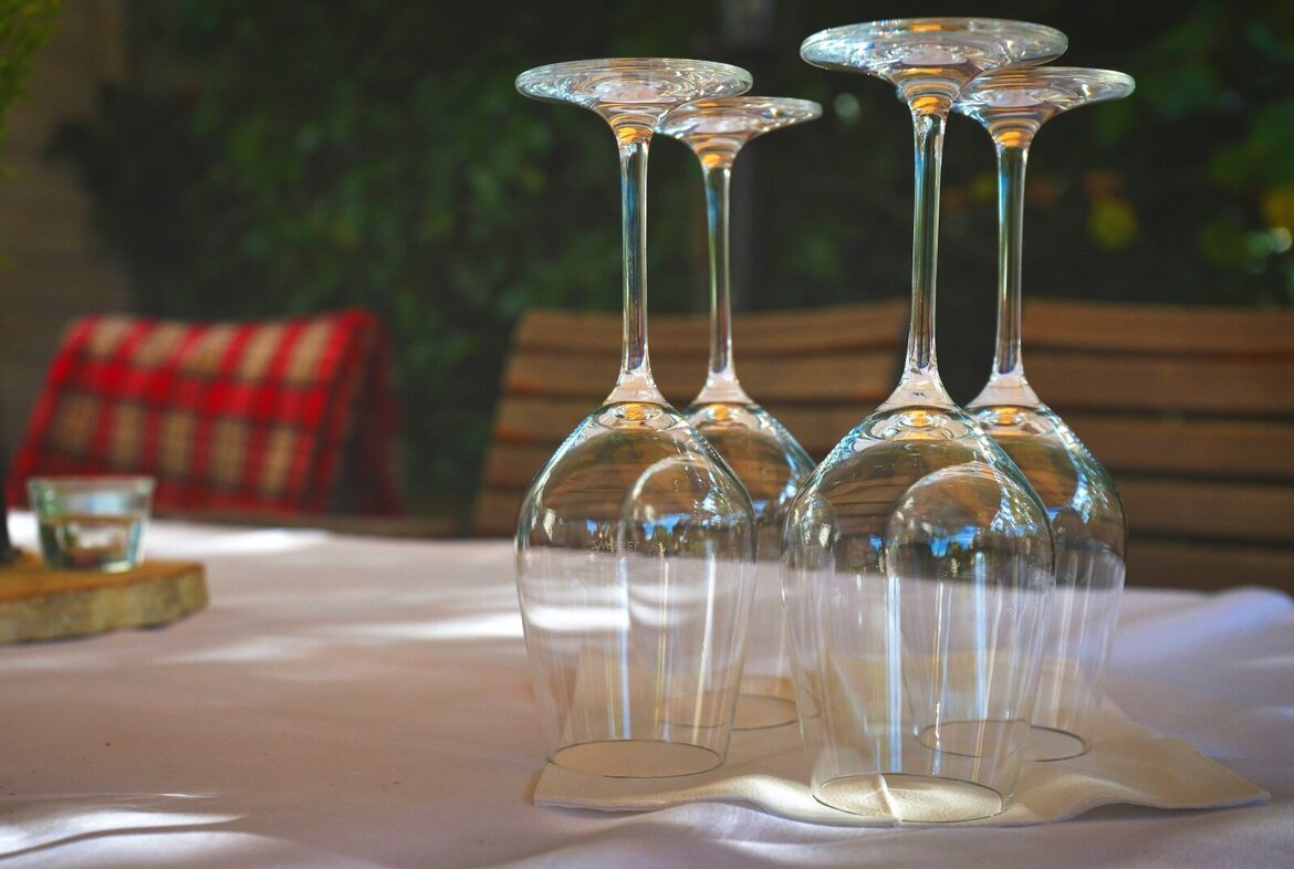 Wine glasses on a restaurant table Wine glasses on a restaurant table